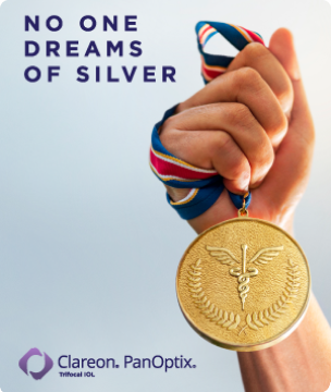 Picture of a hand holding a gold medal