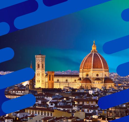 View of Florence, Italy at dusk featuring the illuminated Cathedral of Santa Maria del Fiore (Duomo) with its red dome