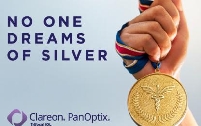 A picture of a hand holding a gold medal