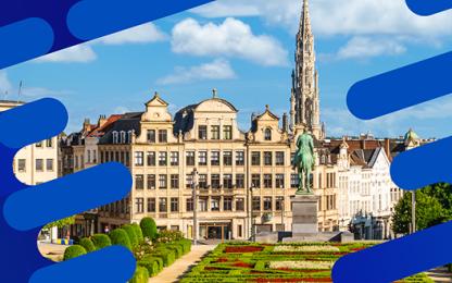 Historic city square in Antwerp, Belgium, with a statue, landscaped gardens, and the Cathedral of Our Lady in the background.