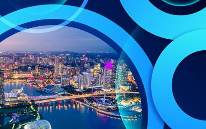 Illuminated city skyline at night with abstract blue circular overlay