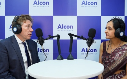 two people with microphones during a conversation